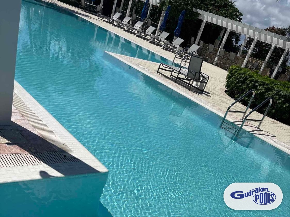 Clear, rippling water over the new finish in a resurfaced Pompano Beach highrise pool